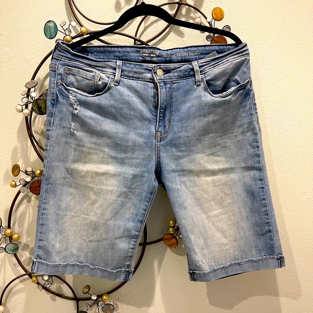 Signature Levi’s Strauss distressed denim shorts .